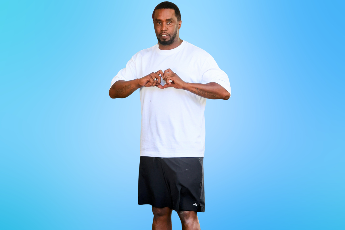 diddy doing love heart sign