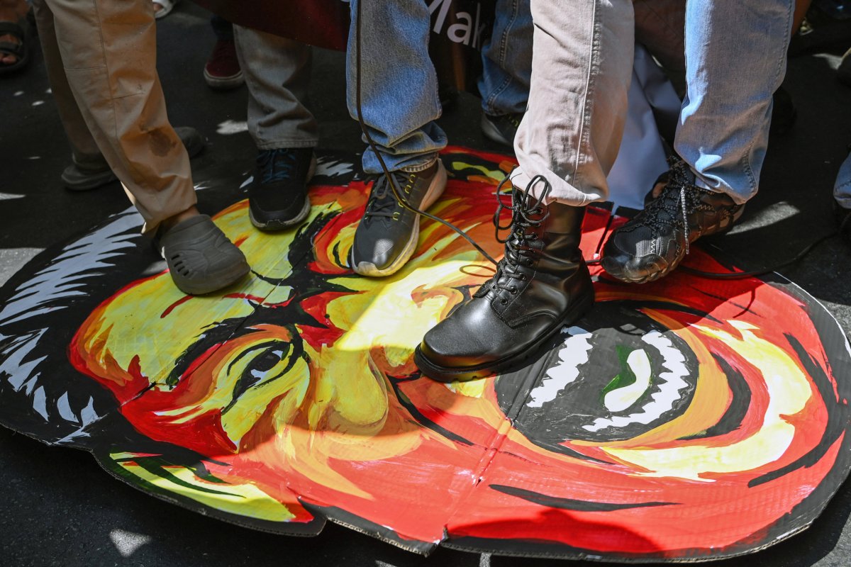 Protesters Stomp on Effigy of Xi Jinping