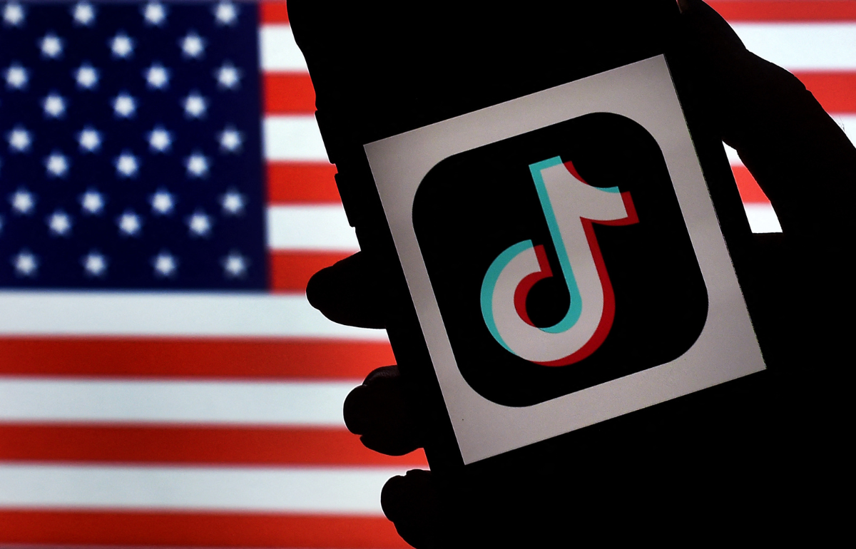 TikTok logo against an American flag background