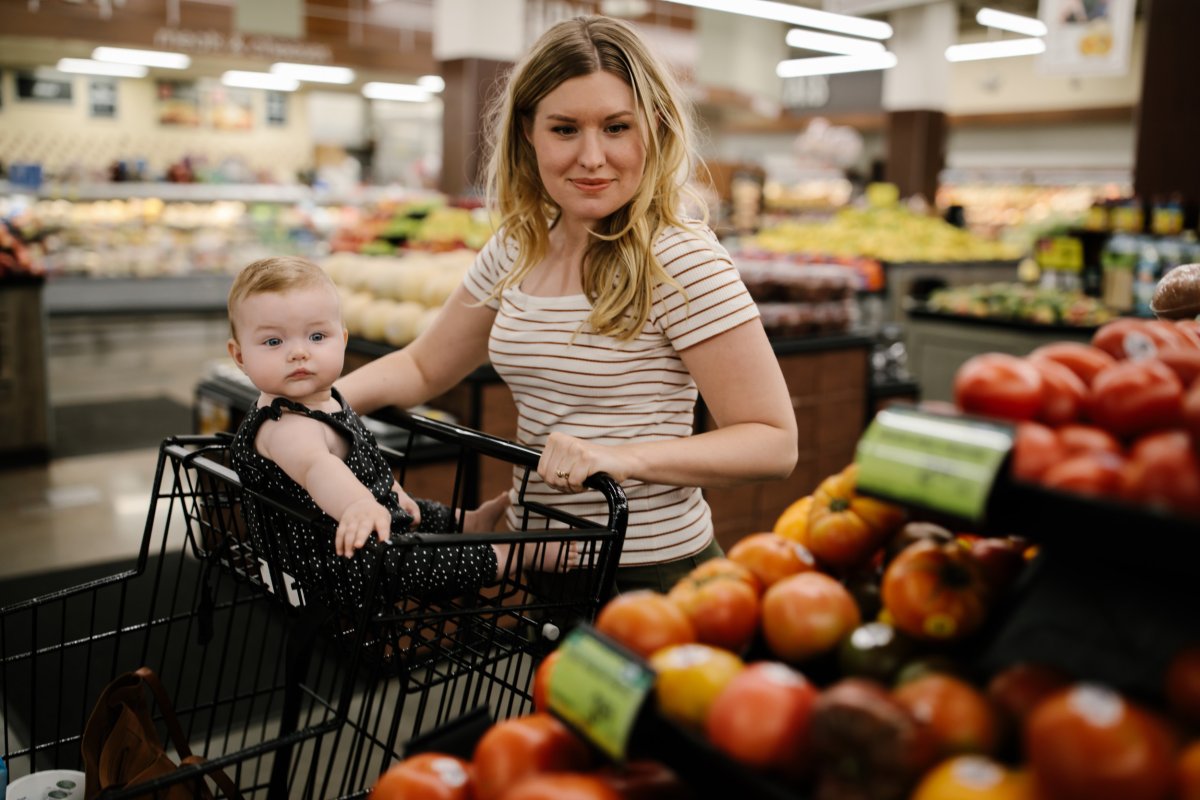 Mother and baby grocery shopping