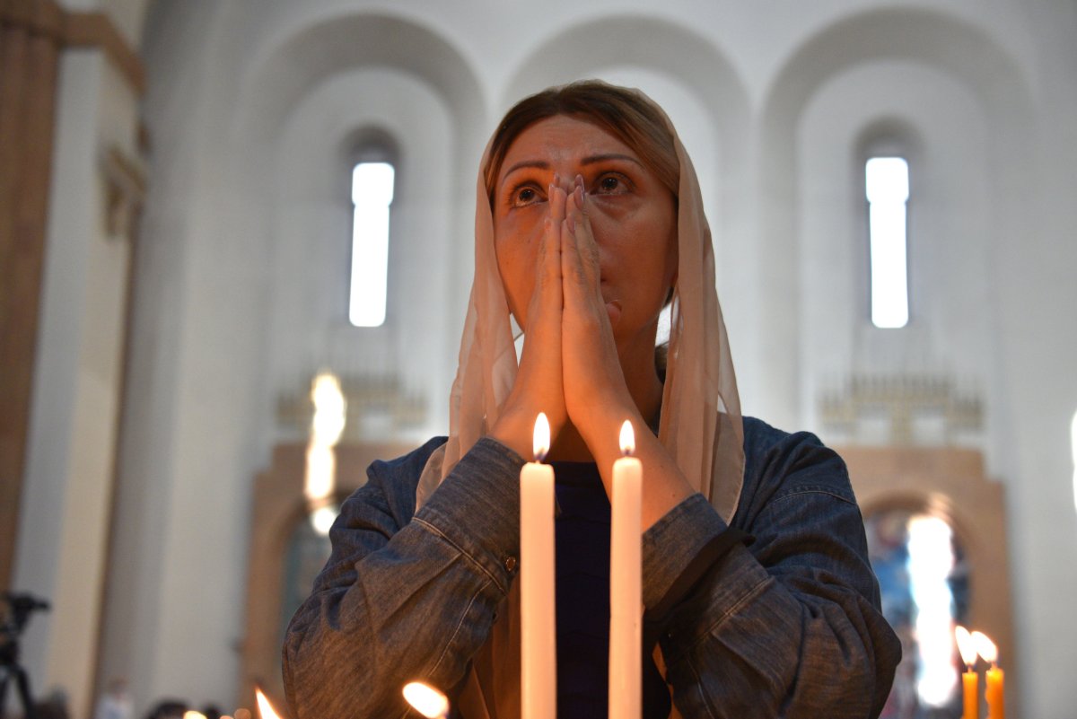 An Armenian woman prays in a church 