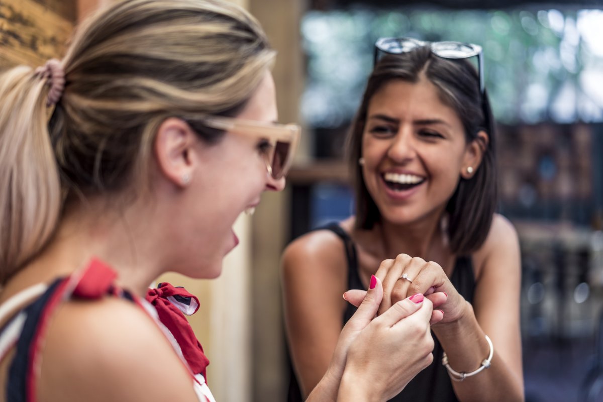 A woman sees her friend's engagement ring
