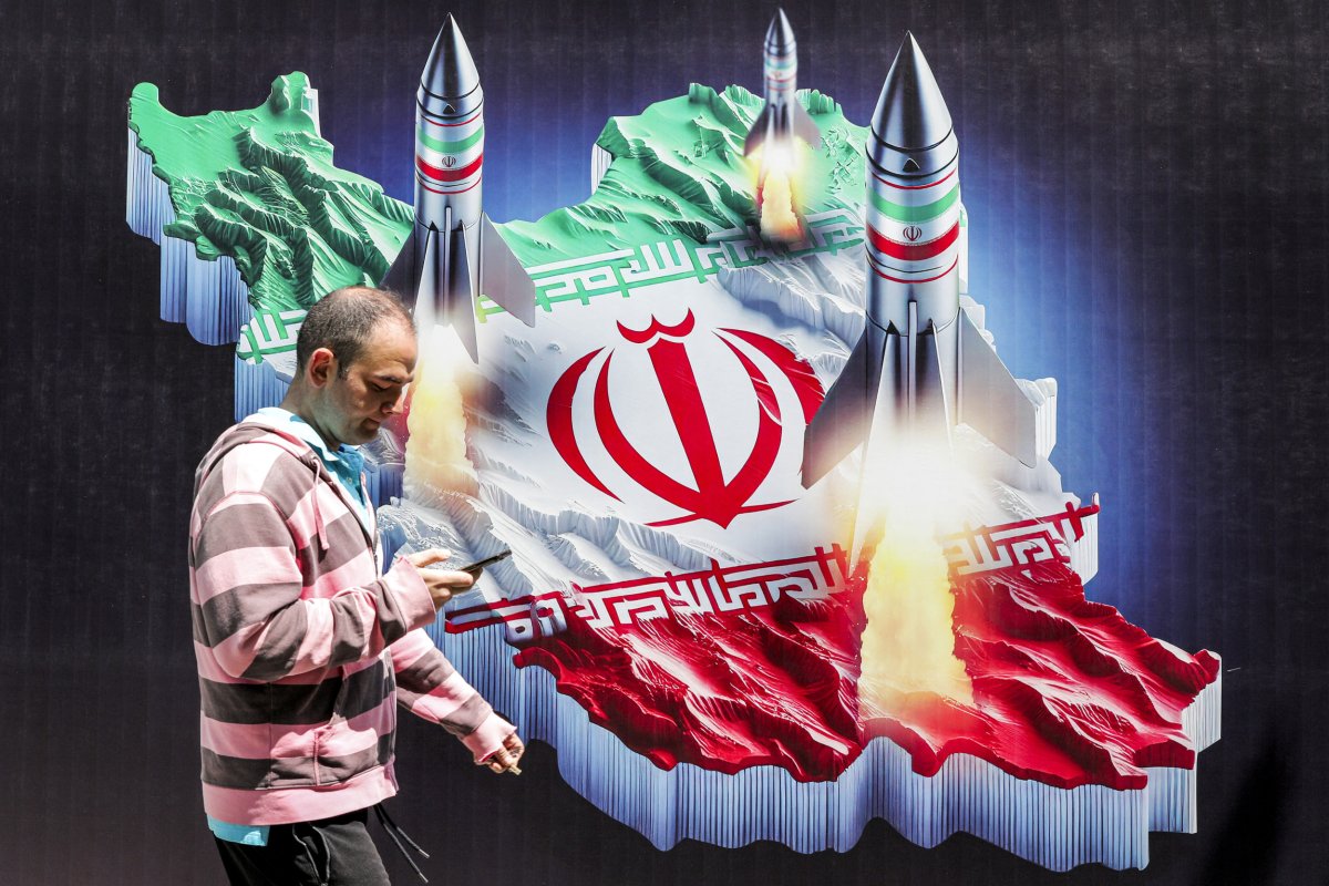 Man with map of Iran and rockets