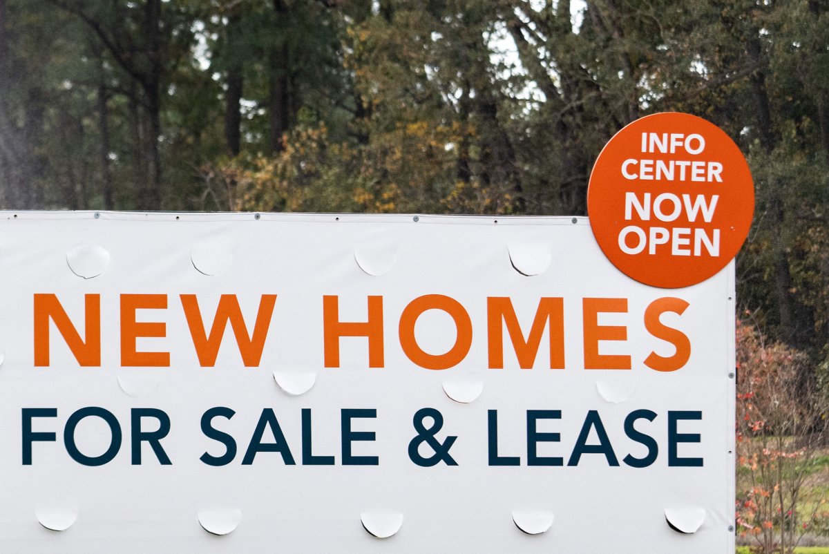 A sign advertises new homes 