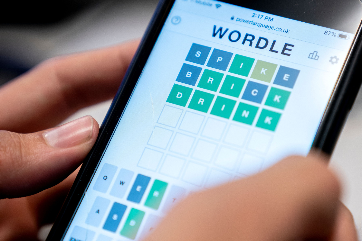 A person playing "Wordle" on a phone