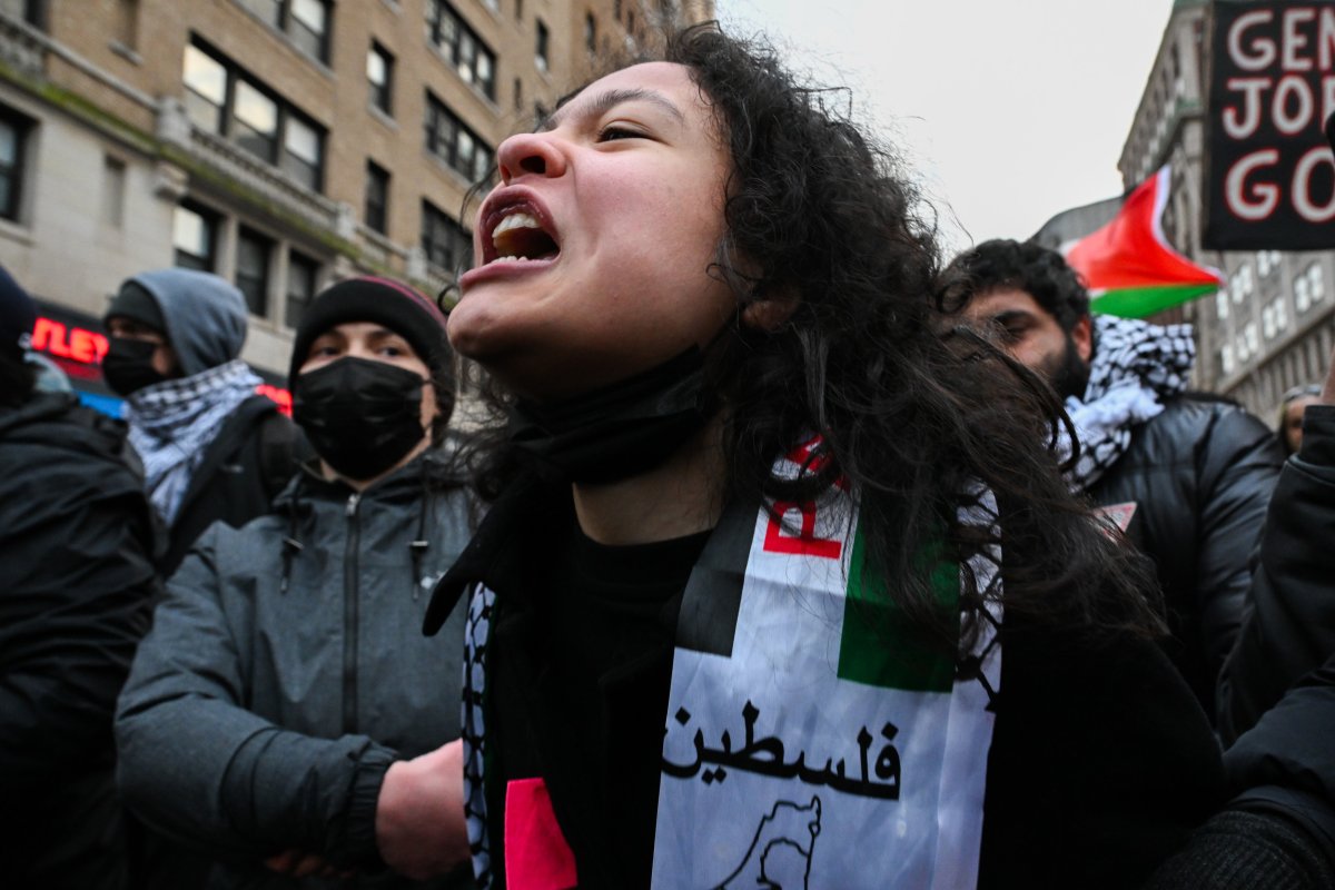 A protestor screams during clashes with NYPD 