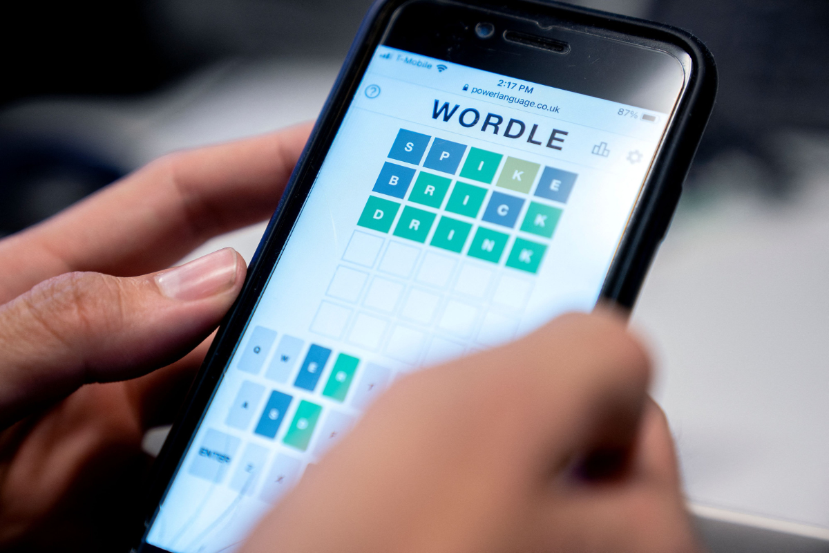 A person playing "Wordle" on a phone