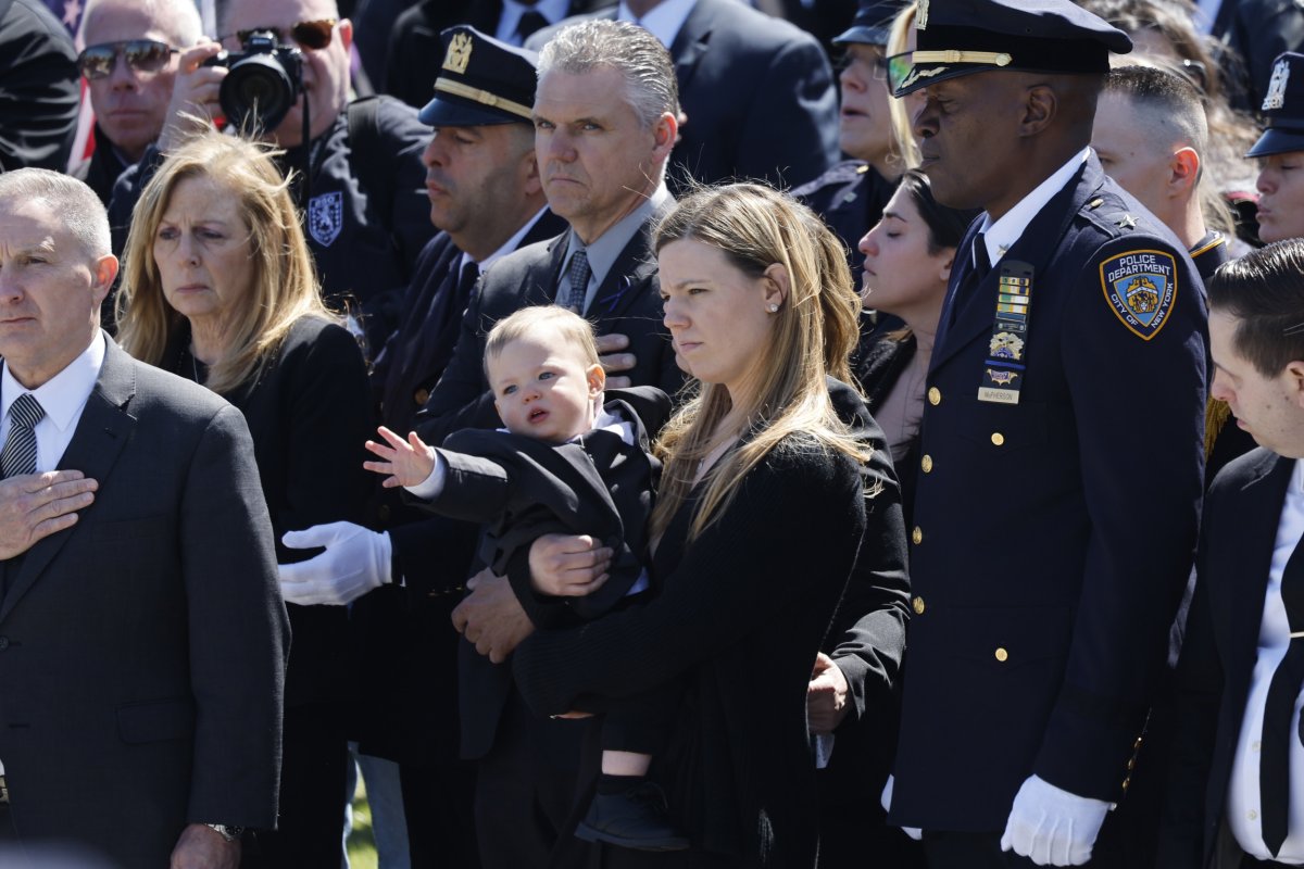 Slain cop's wife at funeral