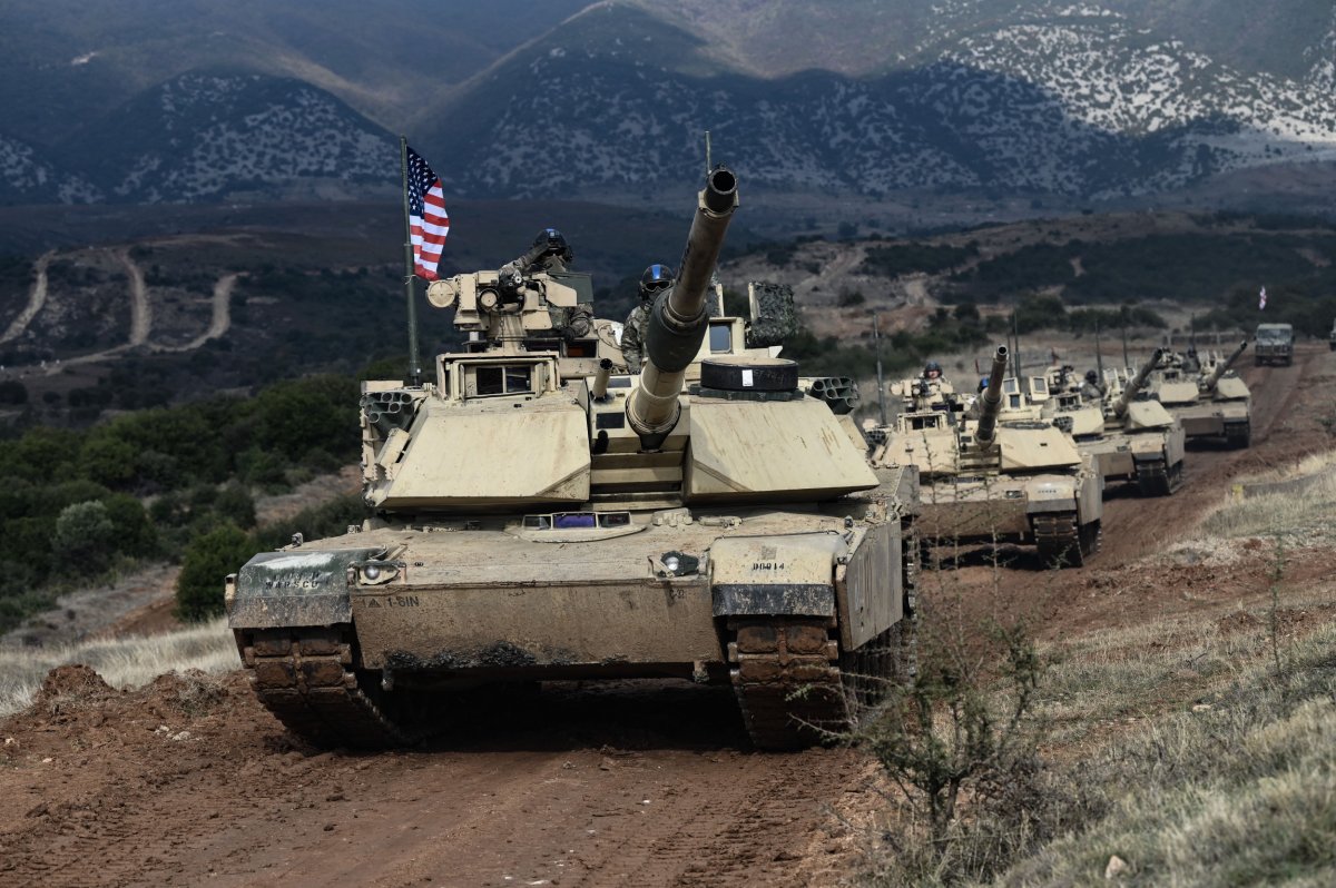 US Army officers drive Abrams tanks 