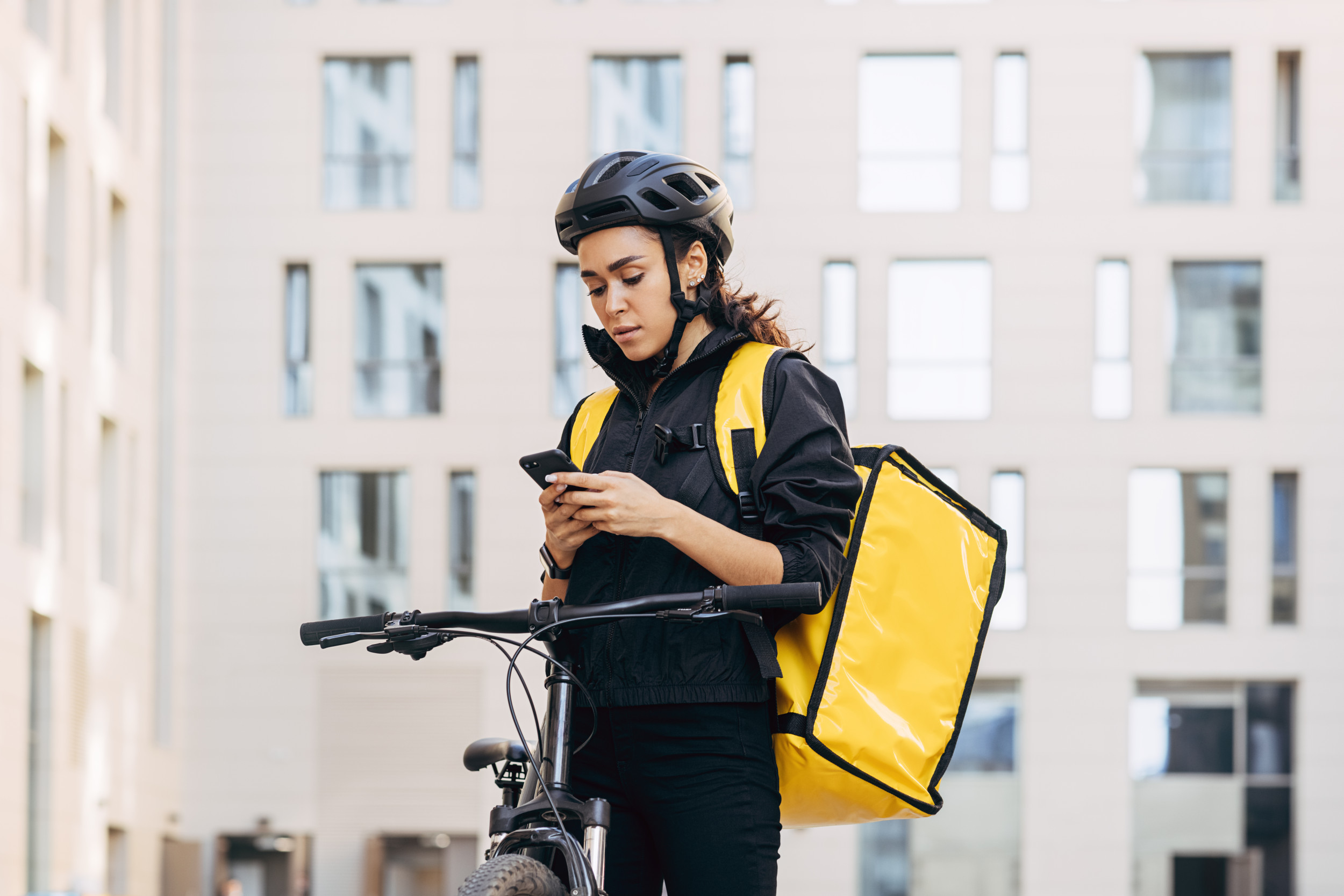 Woman courier with backpack