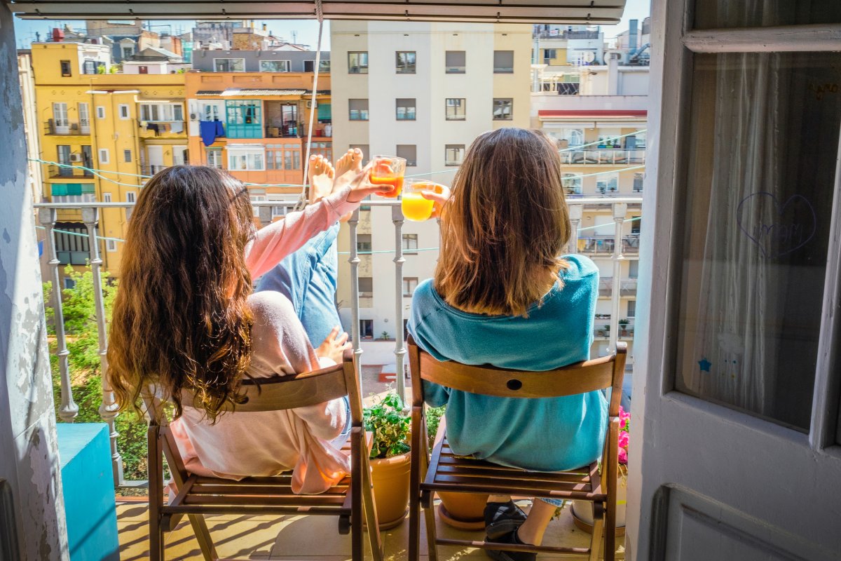 Women drinking on Barcelona balcony