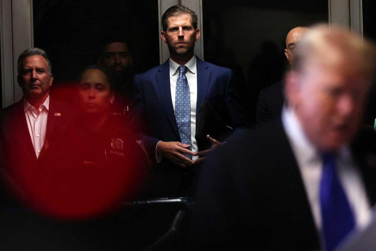 Eric Trump outside the court with Donald Trump