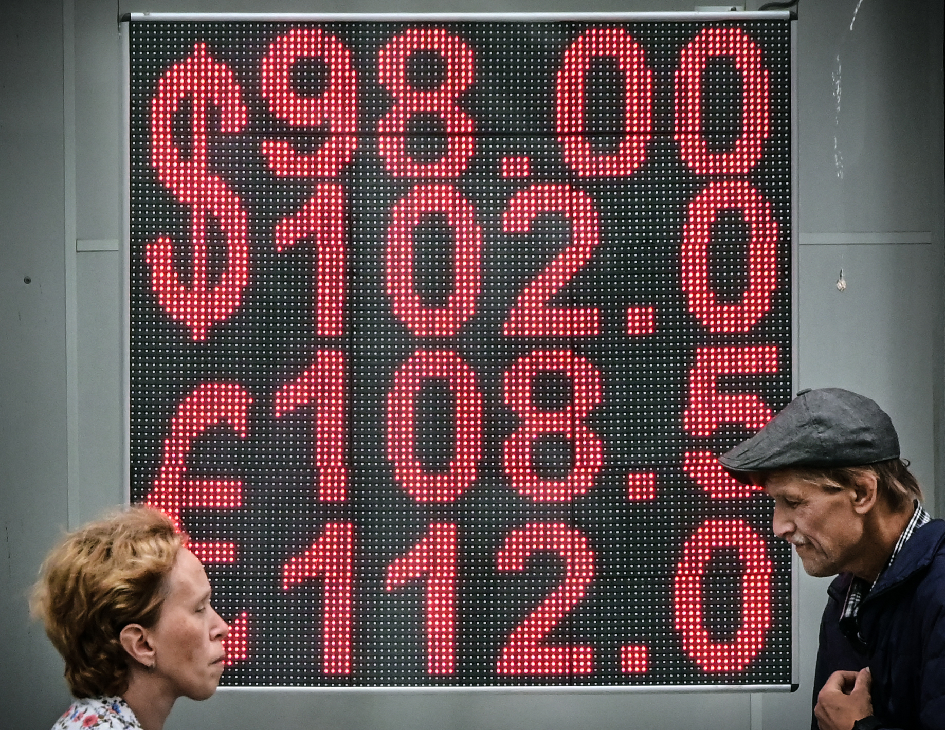 Russians Line Up To Buy US Dollars As Ruble Plummets After New Sanctions