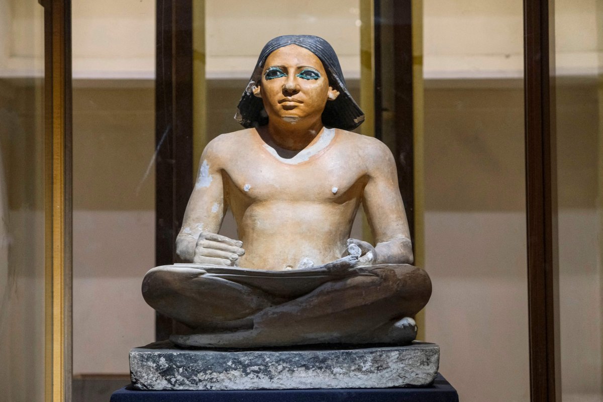 A statue of an ancient Egyptian scribe