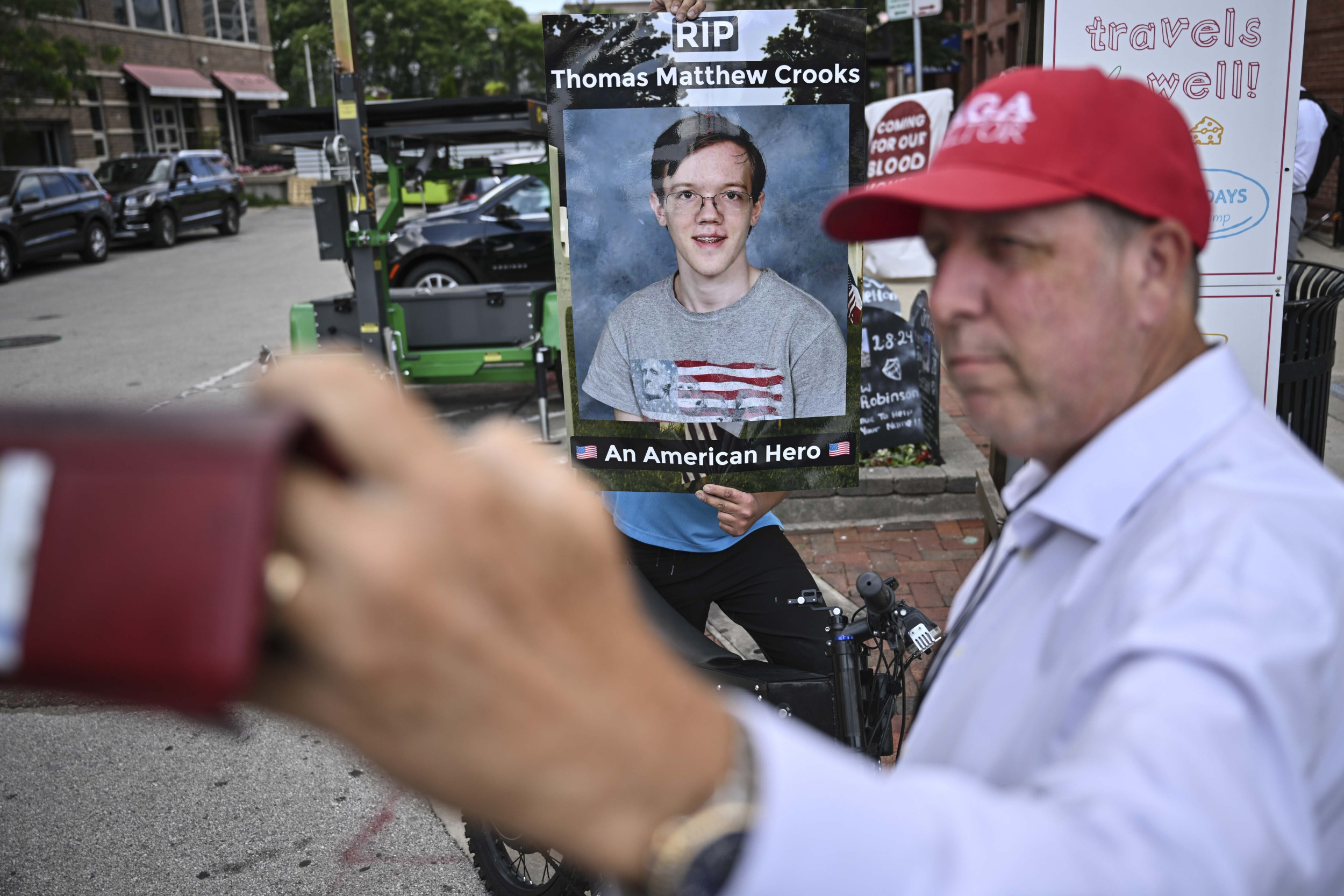 Armed Person Stands Outside RNC With Poster Calling Thomas Crooks a