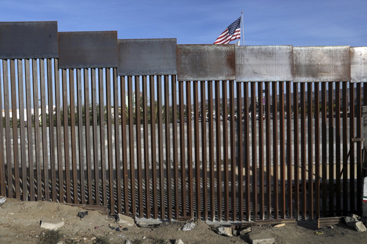  U.S. flag flies behind the border wall