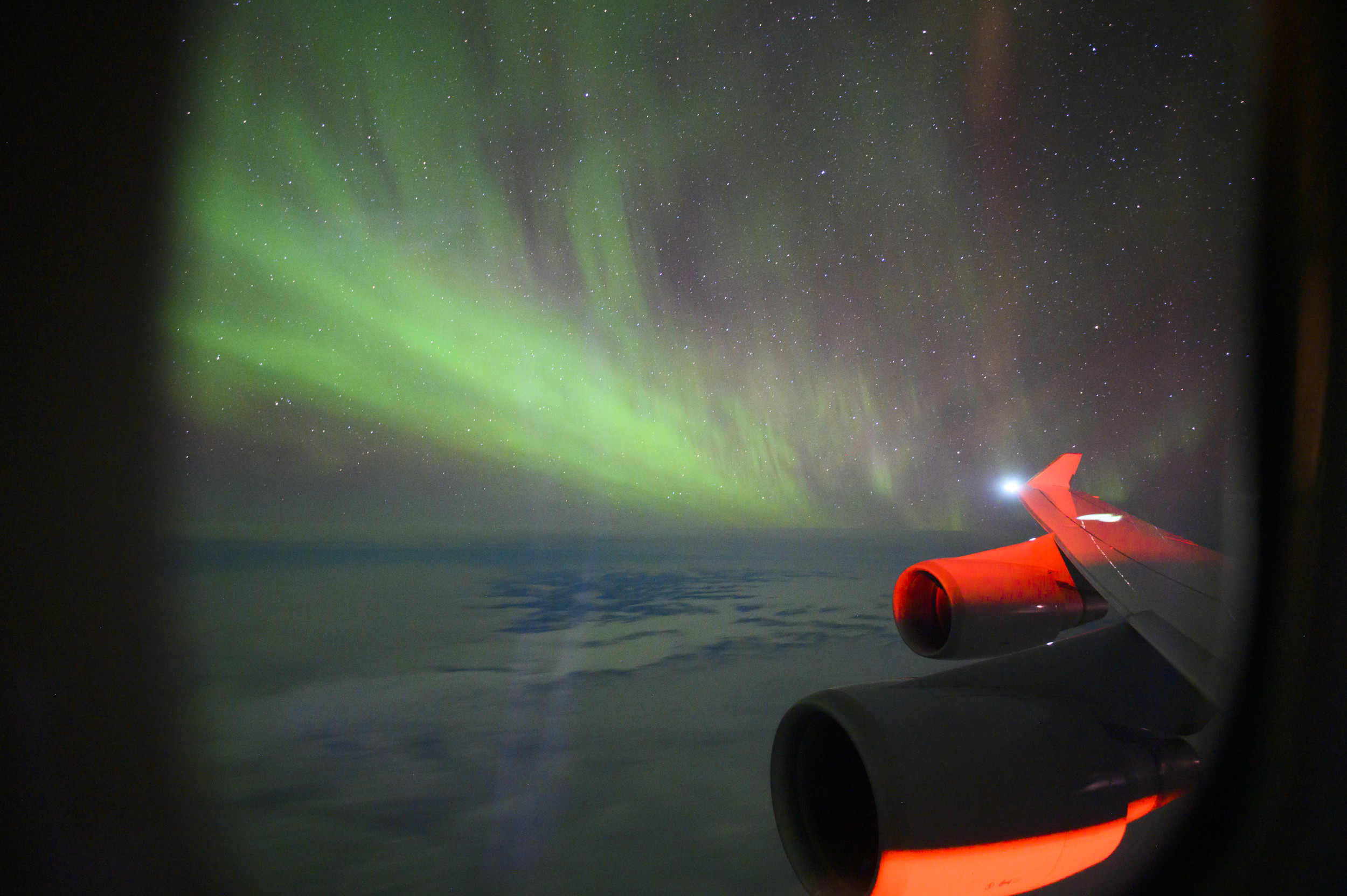 Photo of Northern Lights Captured by Plane Passenger Leaves in