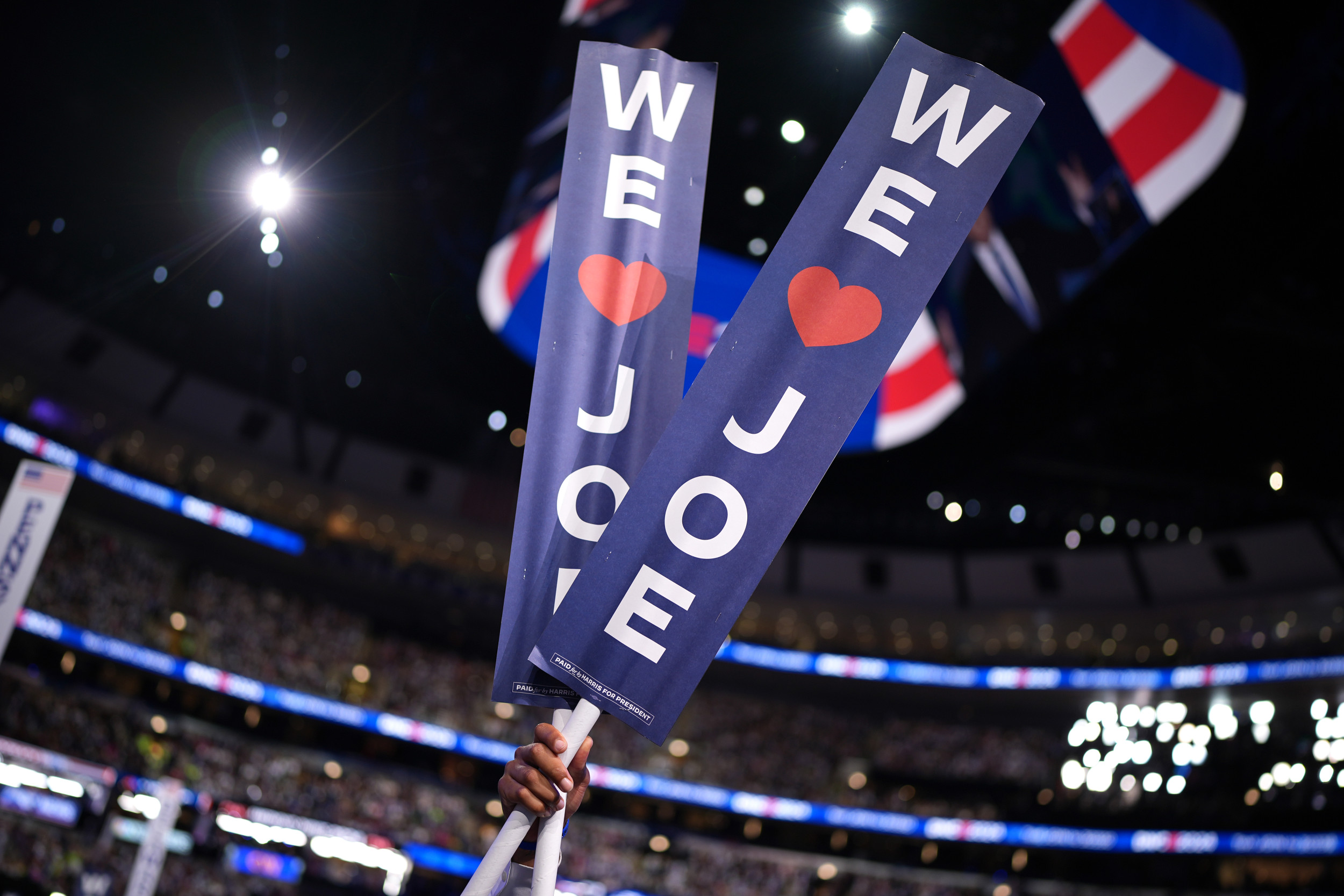 Protester Hit With We Love Joe Sign During Biden S Dnc Speech Newsweek