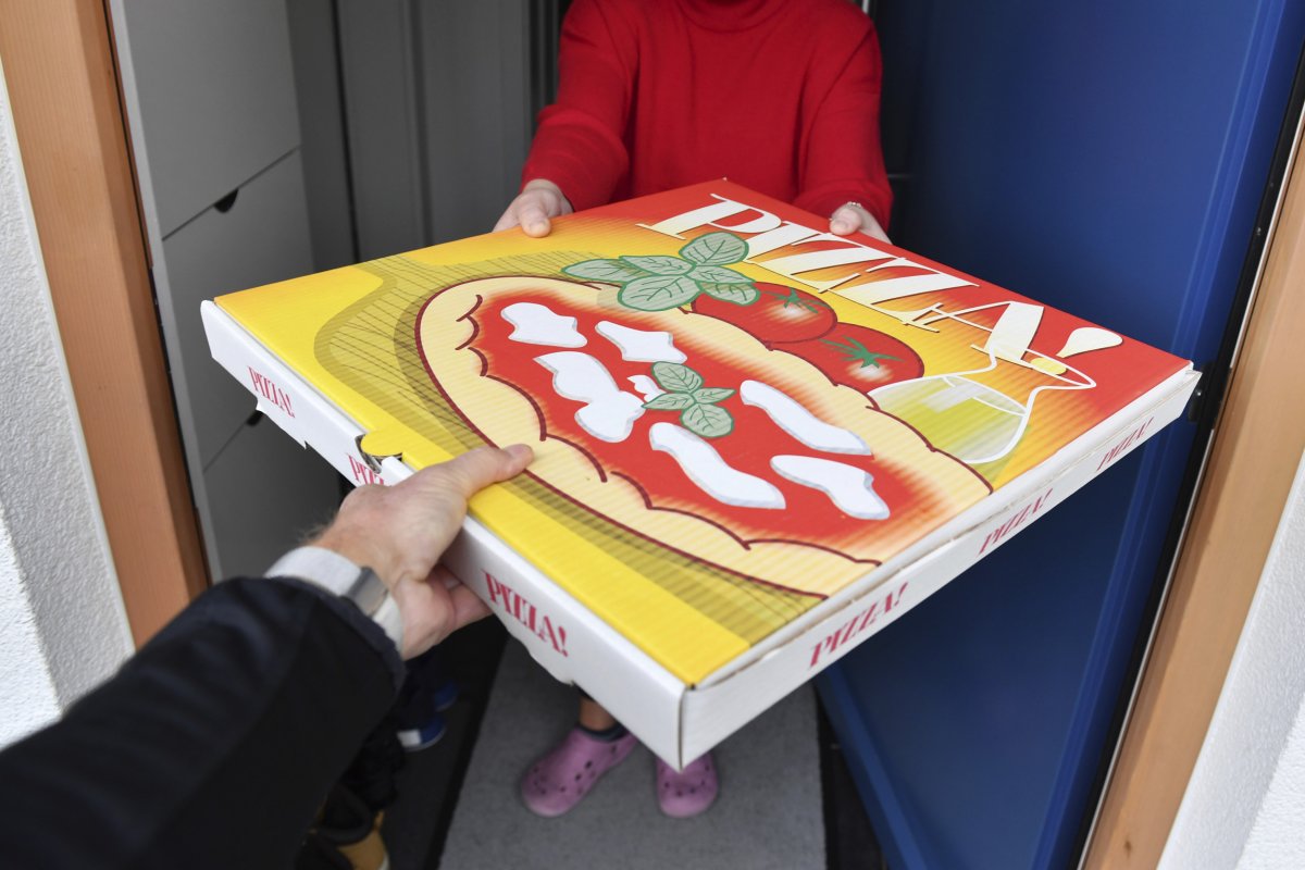 Pizza Delivery Handed to Customer