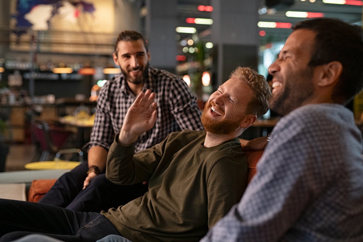Men enjoy themselves at a bar