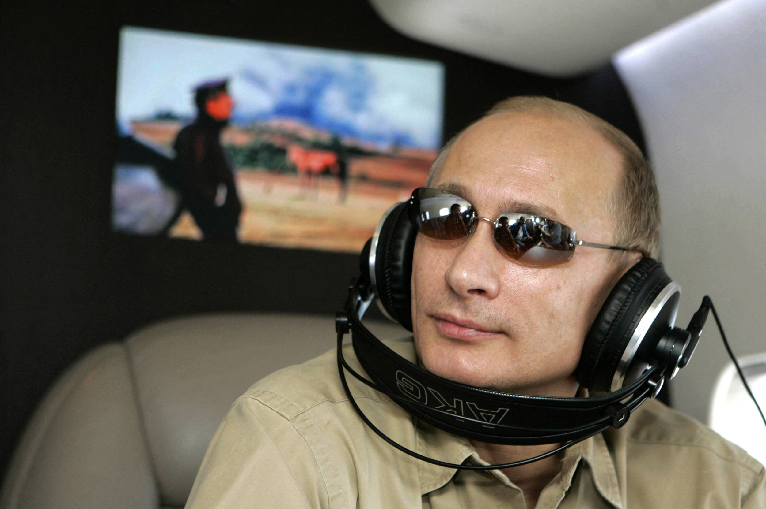 Putin’s earmuffs mishap sparks mockery