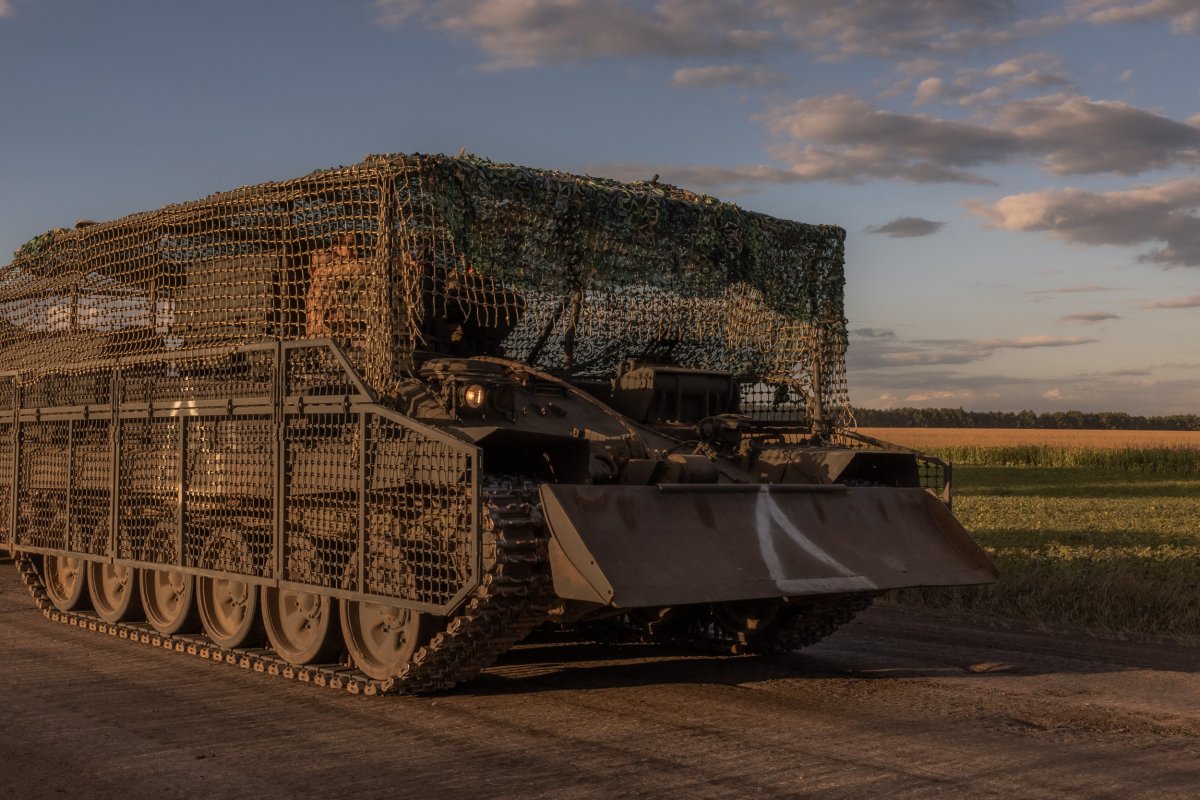 Ukrainian servicemen operate an armored military vehicle
