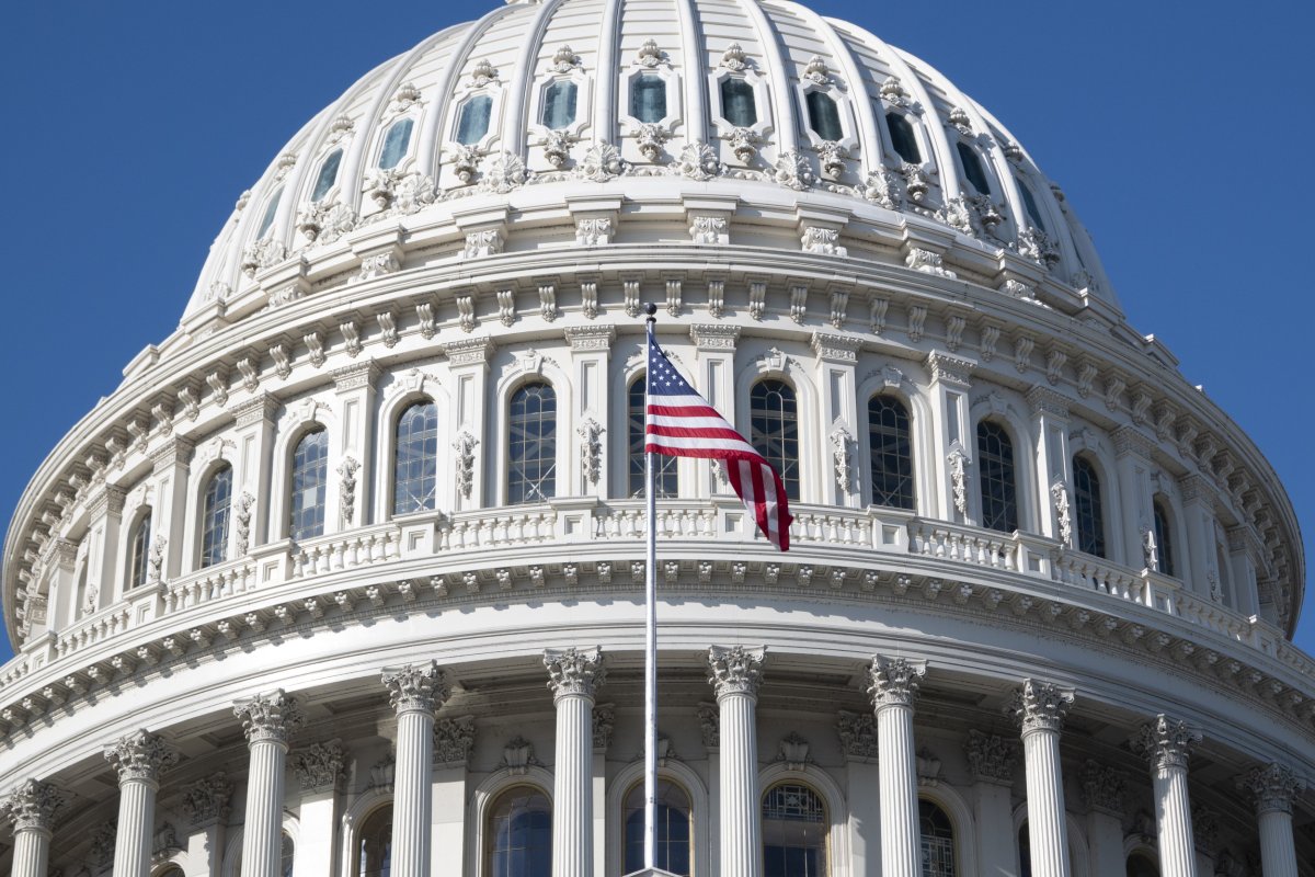 An American flag flies outside the U.S. Capitol building.