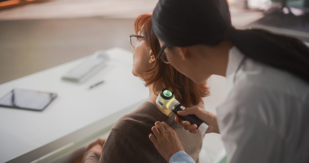 Female Dermatologist Checks For Melanoma