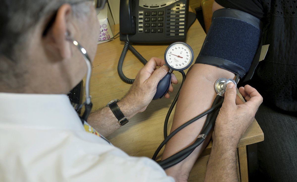 Doctor Examining Patient in Office