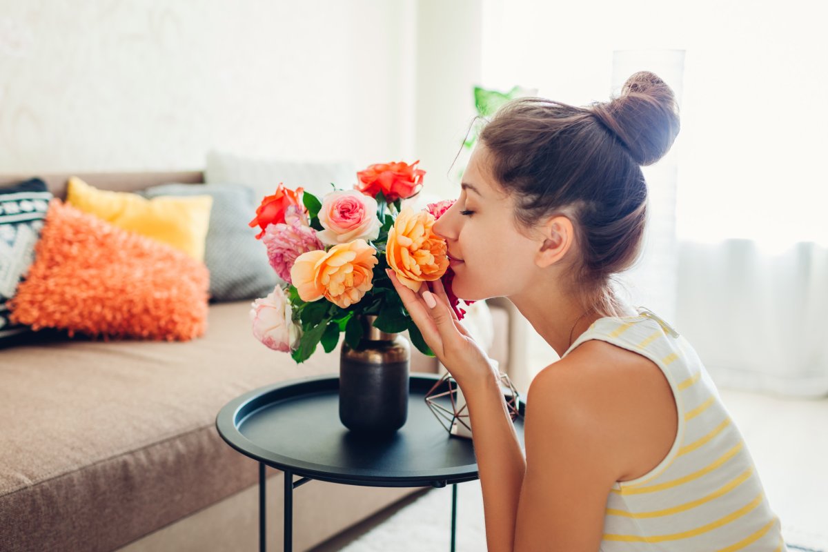 Woman smelling flowers