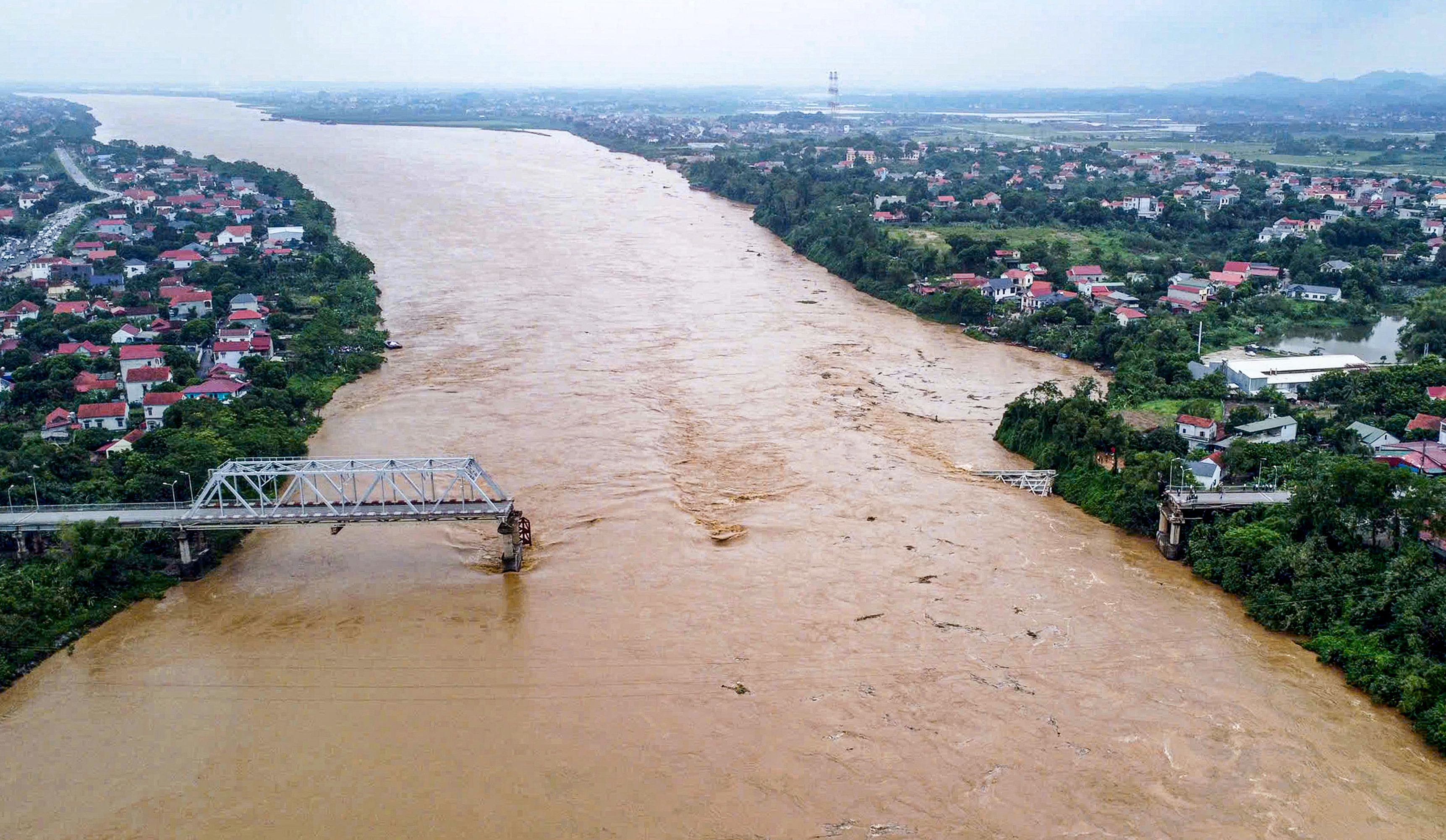 Vietnam bridge collapse and flash flooding leave at least 59 dead