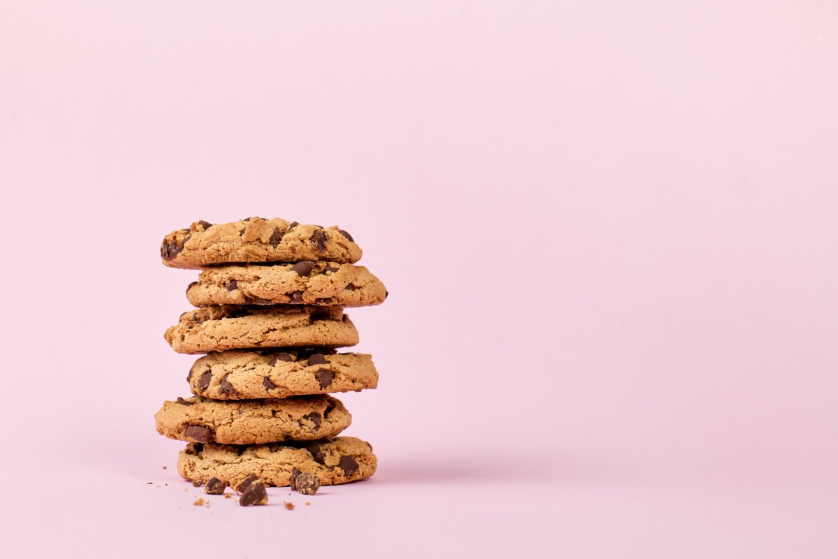 Pile of cookies isolated on pink background