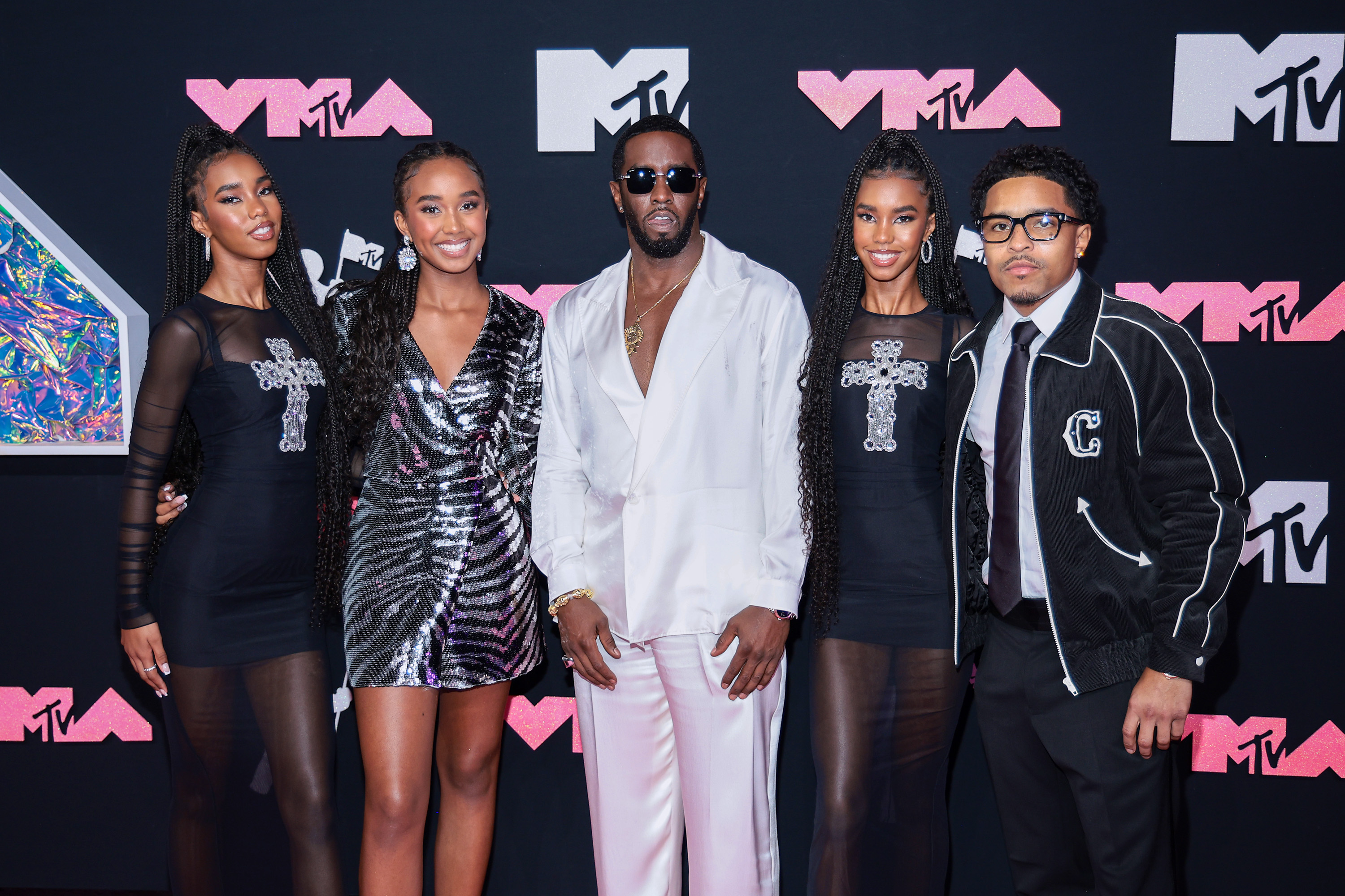 Where do Diddy’s teenage daughters reportedly live given legal troubles?