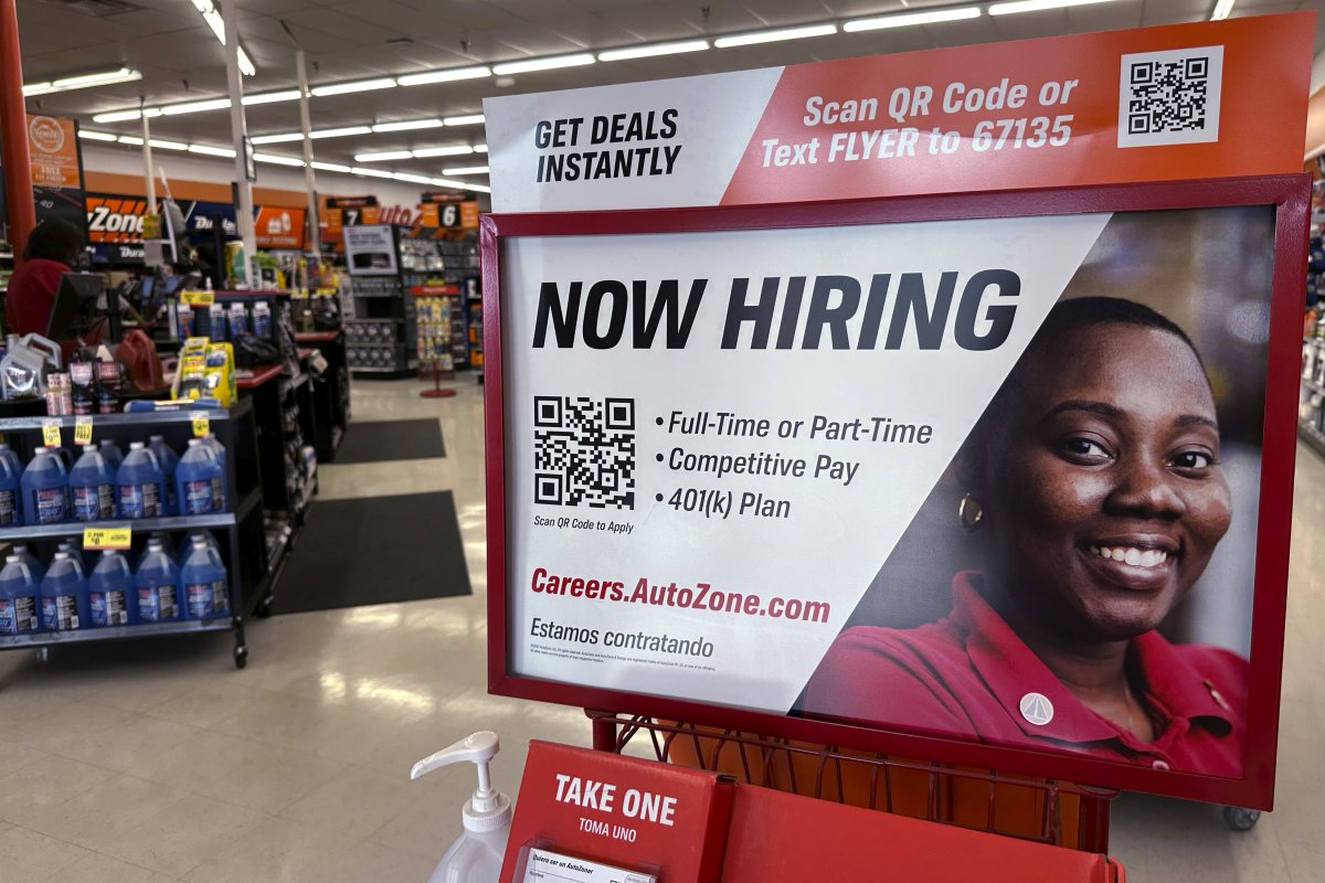 A hiring sign displayed in a store