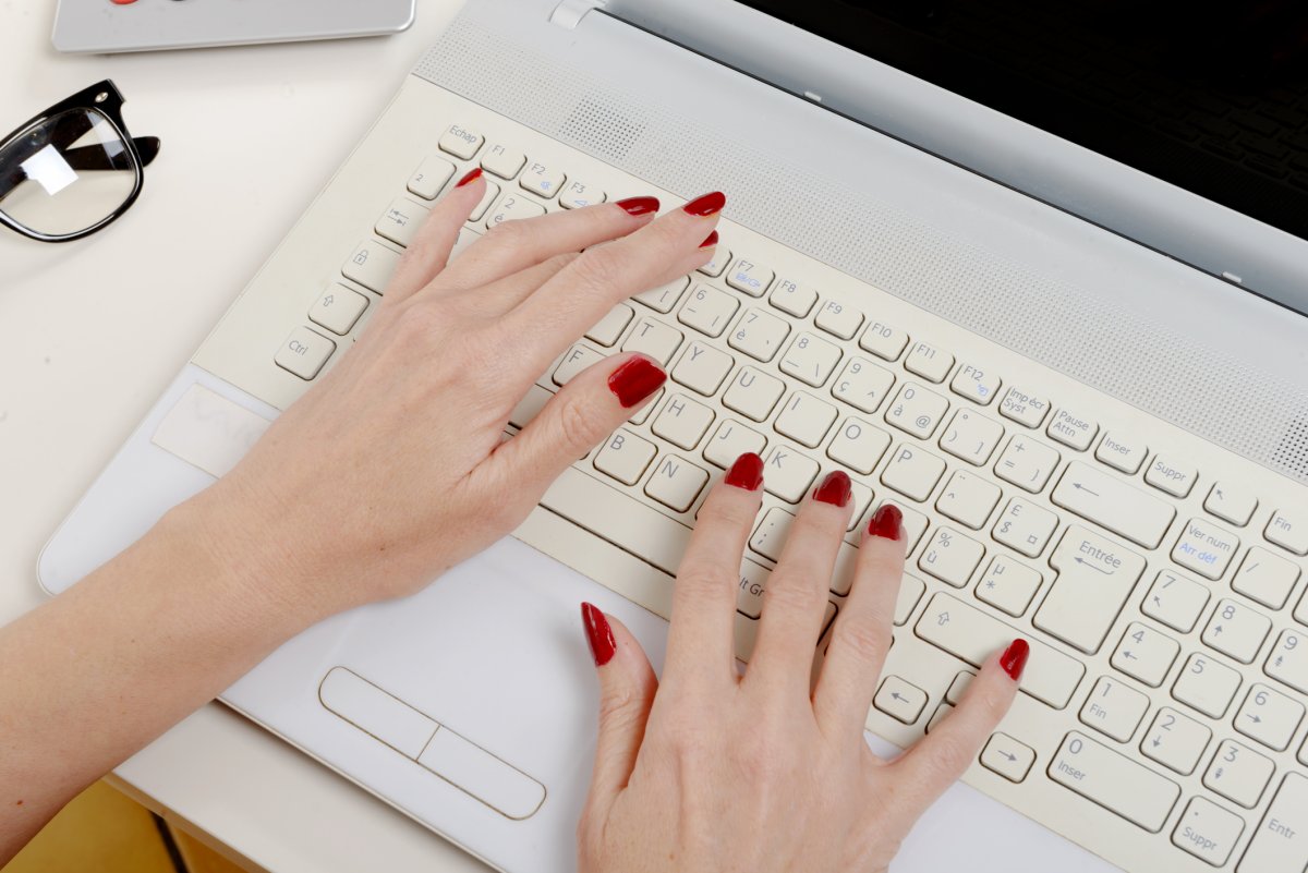 Stock image of woman typing.