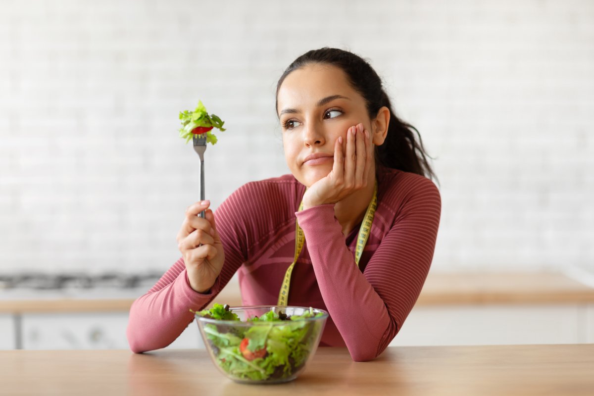 Woman eating salad