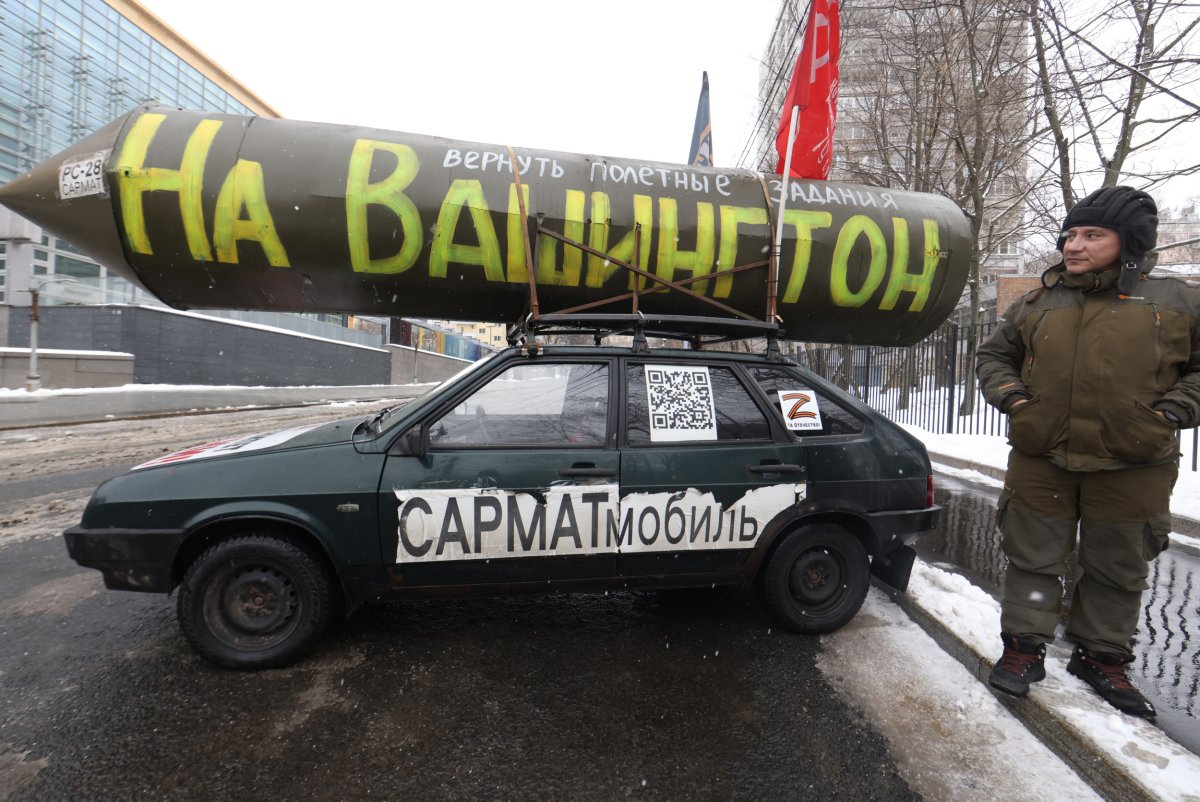 Pro-Putin supporter with nuclear weapon replica