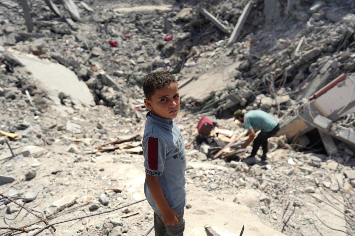 Palestinians check rubble in Gaza