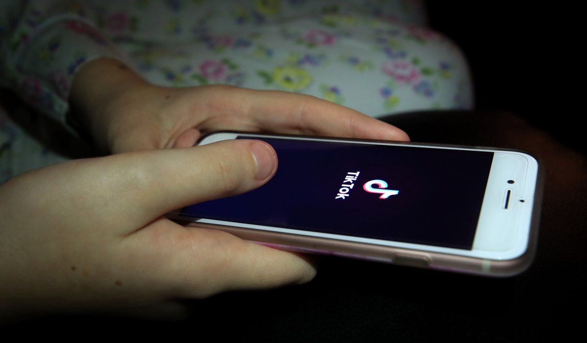 Person Using TikTok on Their Phone