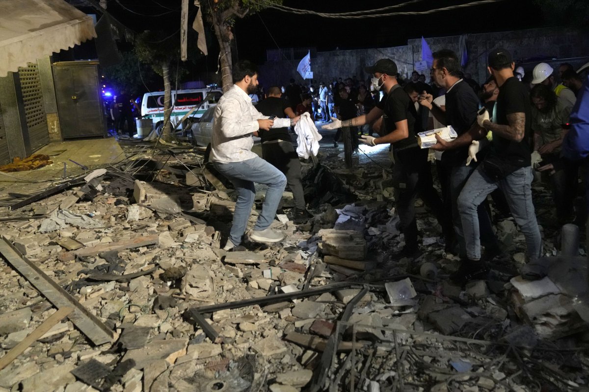People search through rubble after airstrike