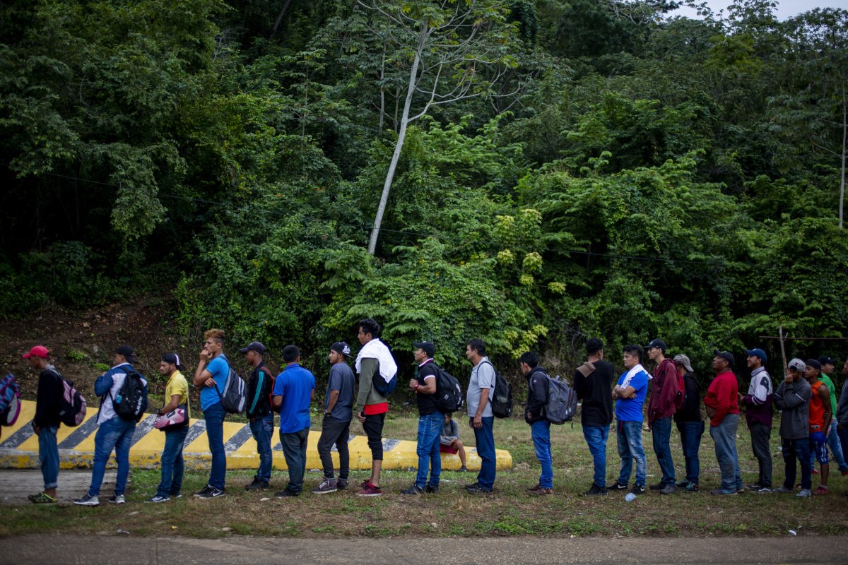 Migrants queuing at the Mexican border with Guatemala