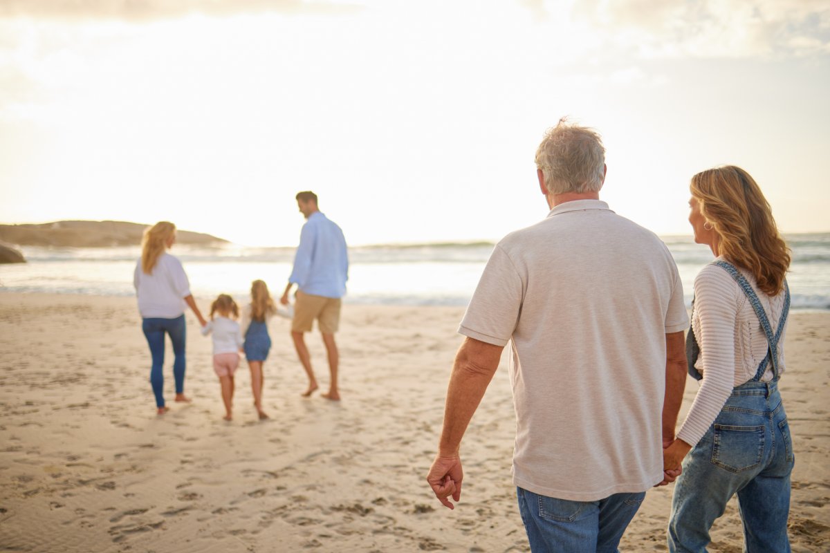 A family walks on a beach