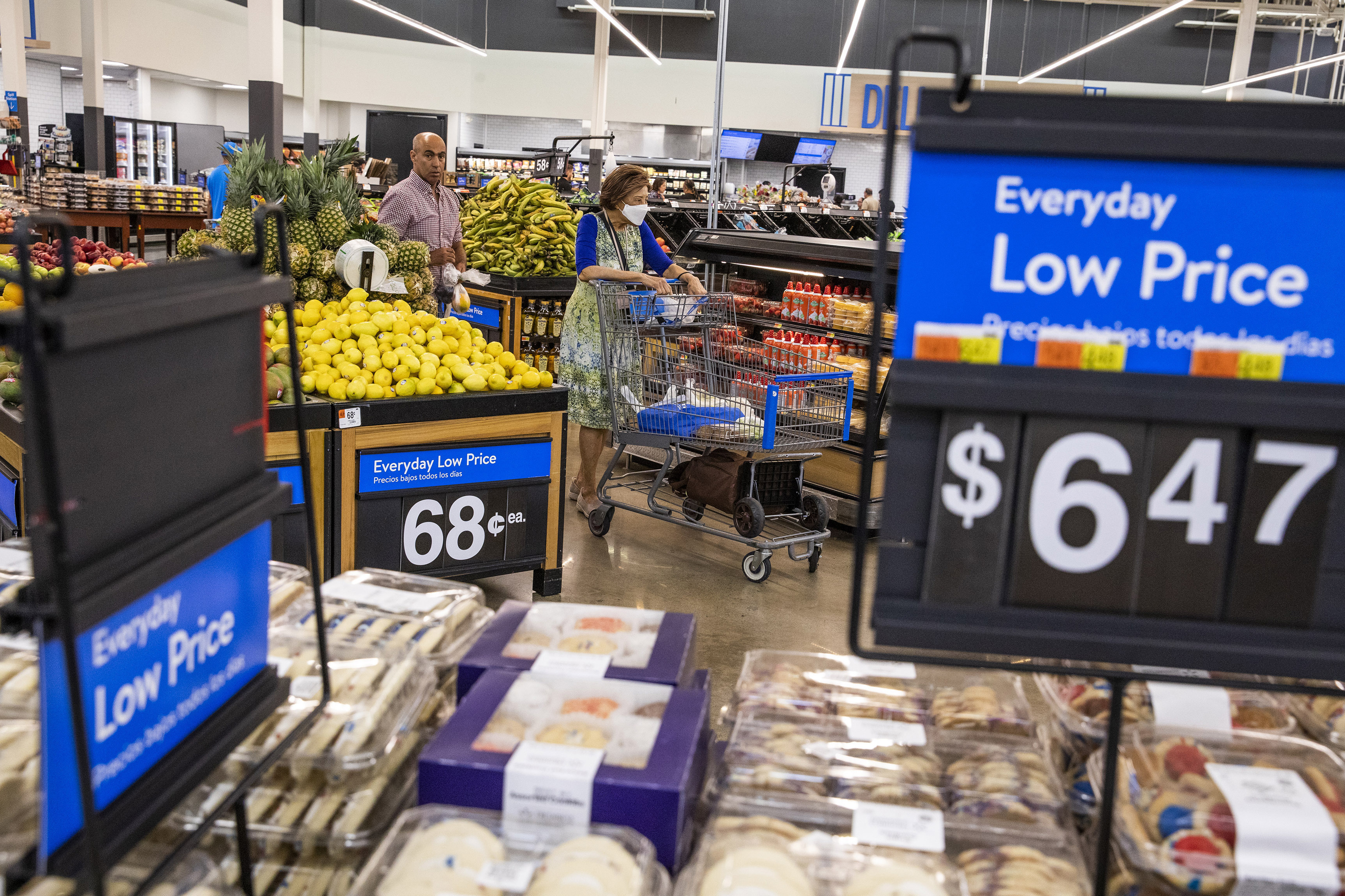 People buy groceries at a Walmart