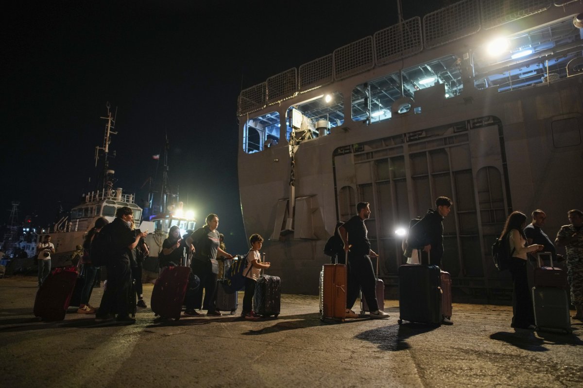 Turkish people line up to board ship