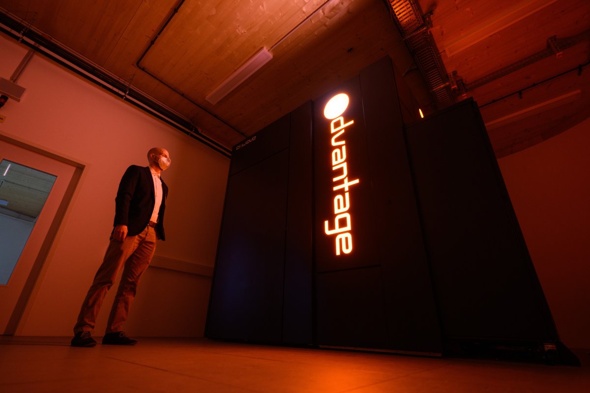 Man Poses by D-Wave Advantage Quantum Computer