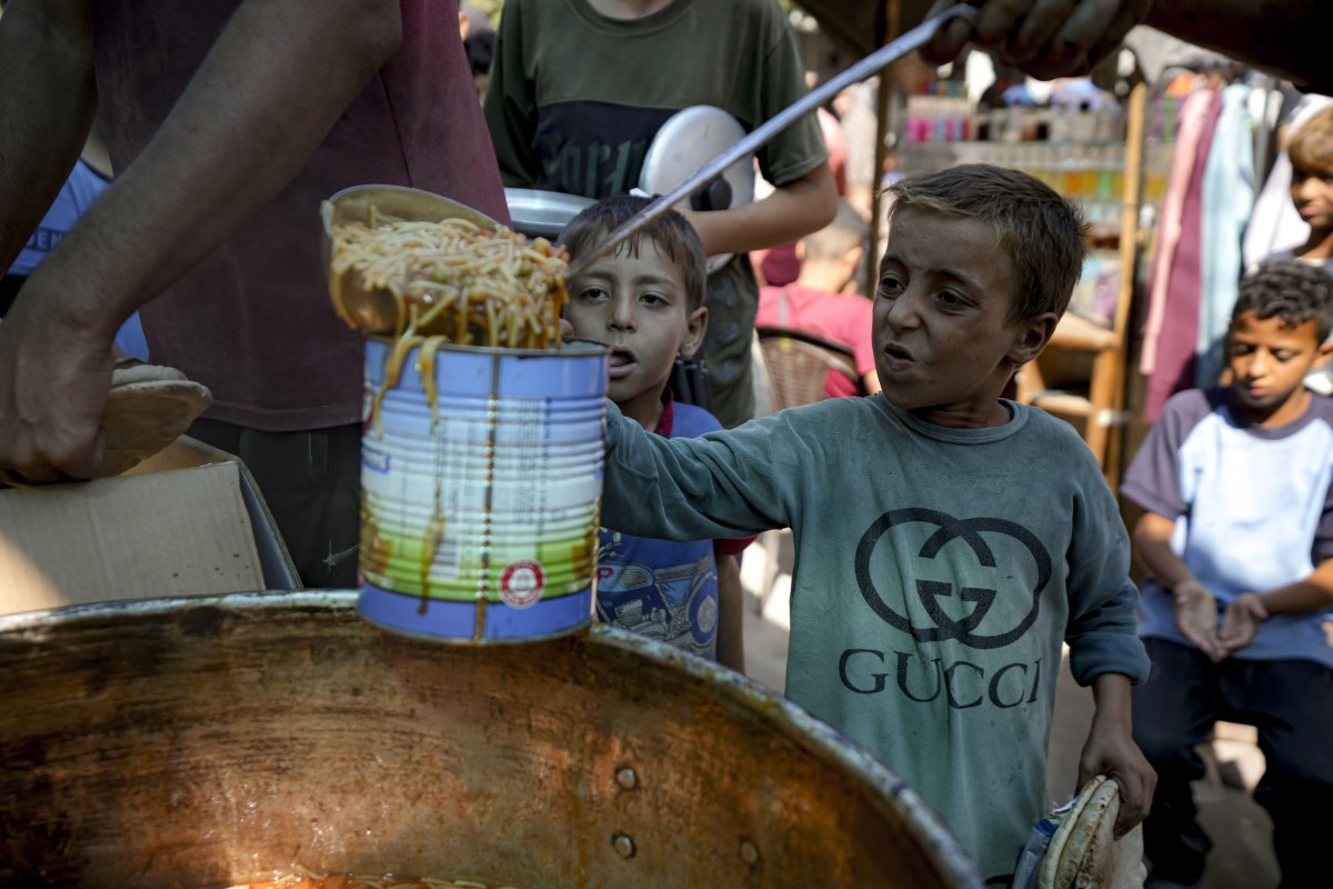 A child in line for food in Gaza