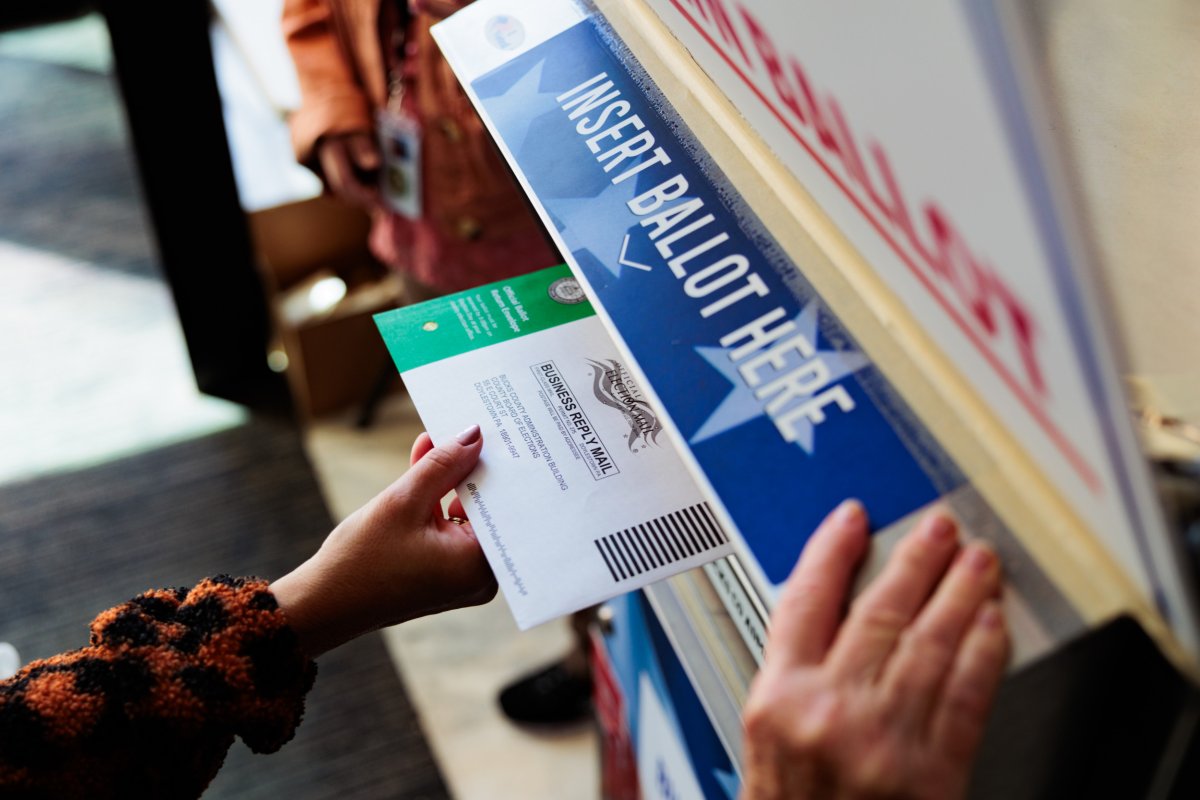     Someone drops off a ballot by mail 