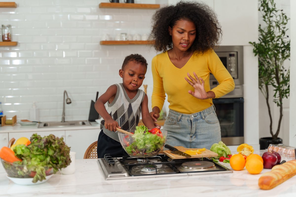 Image of a woman and son cooking.