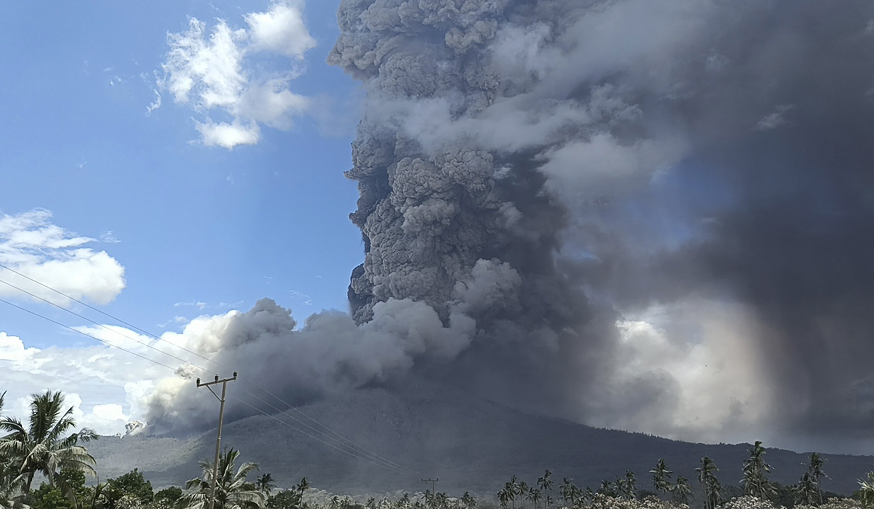 Highest Alert for Volcano Unleashing Columns of Hot Clouds