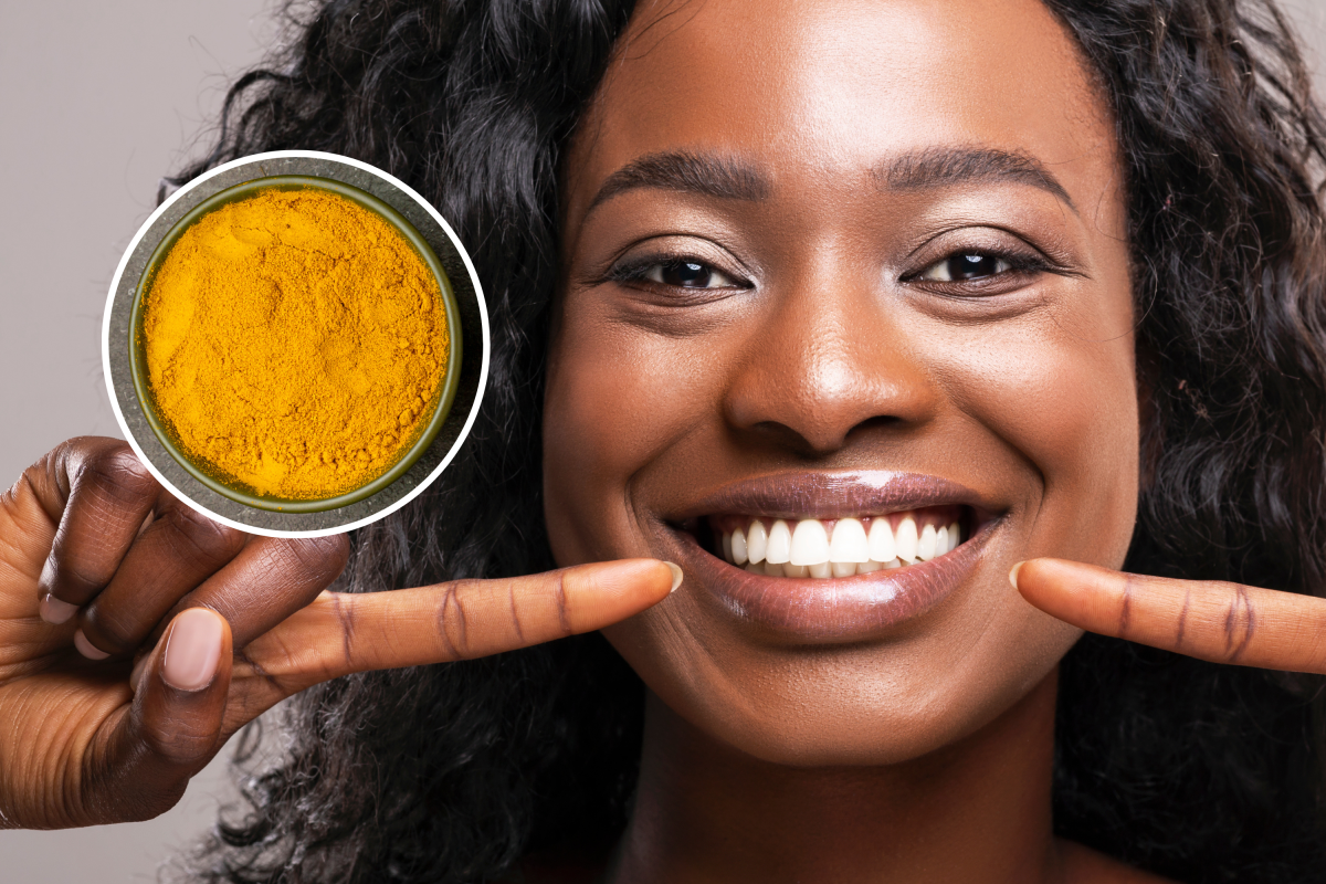 Happy woman pointing at her teeth